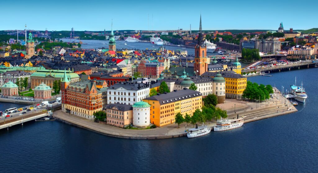 A scenic view of Stockholm, Sweden, showcasing its iconic architecture and waterways in a vibrant European setting.