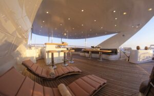 The luxurious deck of M/Y GRANDE AMORE, adorned with comfortable lounge chairs, perfect for sunbathing and leisure.