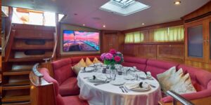 Elegant dining room aboard the DARK STAR OF LONDON yacht, featuring stylish decor and a luxurious atmosphere.