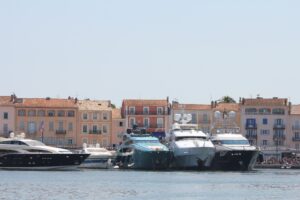 A tranquil body of water featuring multiple yachts, creating a peaceful maritime atmosphere.